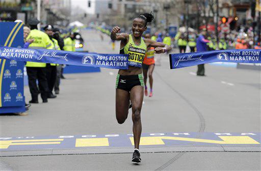 A happy Caroline Rotich of Kenya punches through the finish tape as she won the women's race in the 2015 Boston Marathon on Monday, April 20. Photo: Fox News Screenshot