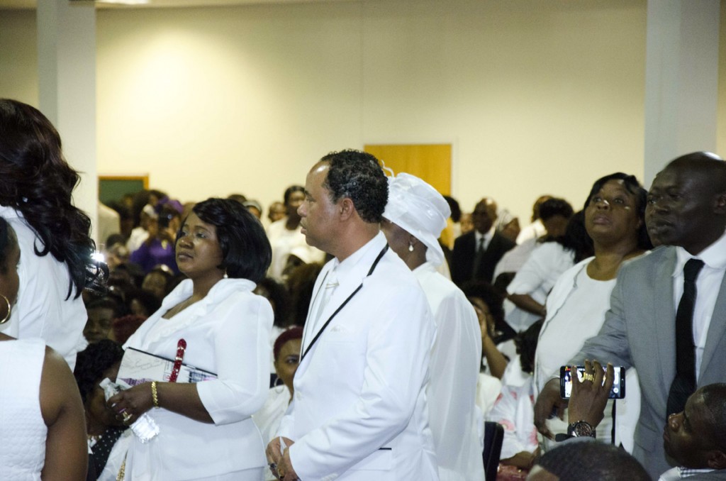 Mourners, including Abdullah Kiatamba (right in grey suit) of African Immigrant Services, stream into Shiloh Temple International Ministries in Minneapolis on May 2, 2015 for the funeral of 10-year-old Barway Collins, exactly three weeks after his body was found on the Mississippi River on Saturday, April 11. His father, Pierre Collins, was taken into custody two days after Barway was found and charged with the murder of his son. Photo: Kaamil Haider/Mshale