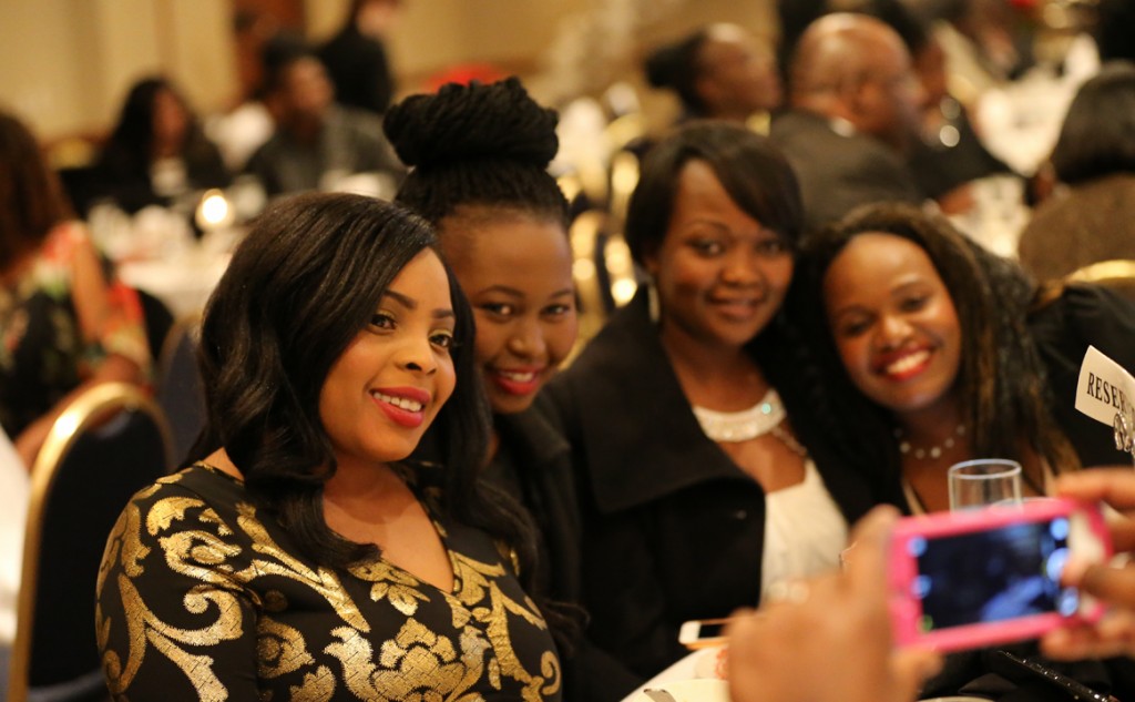 Minnesota Kenyans take selfies during a Jamhuri Day dinner on Saturday, December 12, 2015 that was keynoted by Sharon Sayles Belton, the first female mayor of Minnesota's largest city and commercial center. Photo: Courtesy of KDR TV