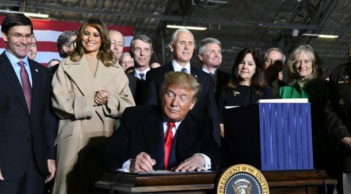 Trump signing law giving Liberians citizenship