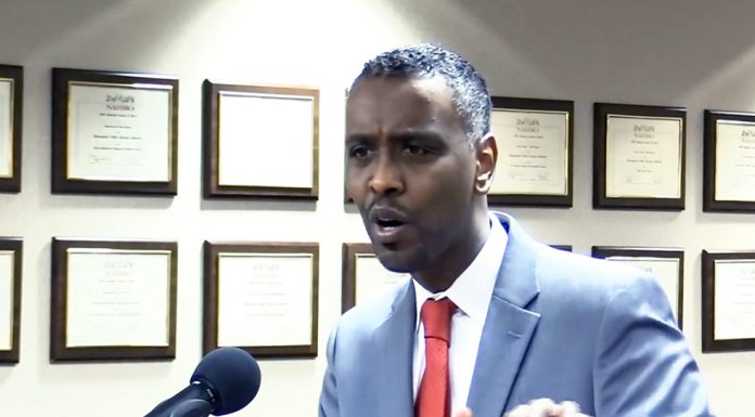 Abdi Warsame becomes first Somali to lead a government agency in Minnesota Abdi Warsame Addresing MPHA Board