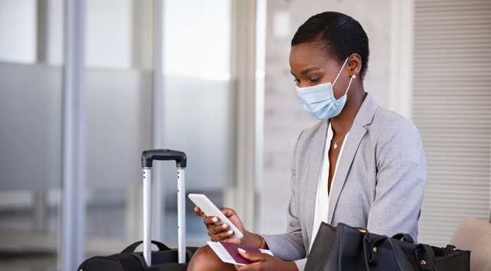 What happens if I get COVID-19 while traveling?