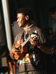 Liberian-born musician Mon Rovia performs with a ukulele