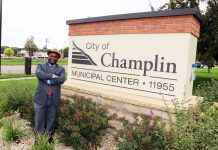 Samuel Mwangi keeps making his case to Champlin voters Samuel Mwangi, a Champlin City Council Ward 4 candidate, stands beside the Champlin Municipal Center sign in Champlin, Minnesota.